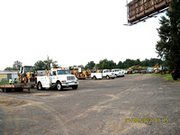 Field Operations trucks parked in side yard